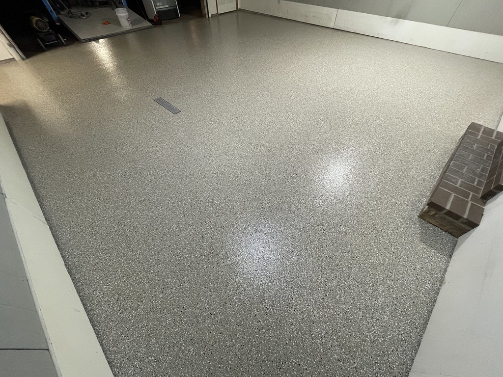 Professional grinding equipment preparing the concrete surface