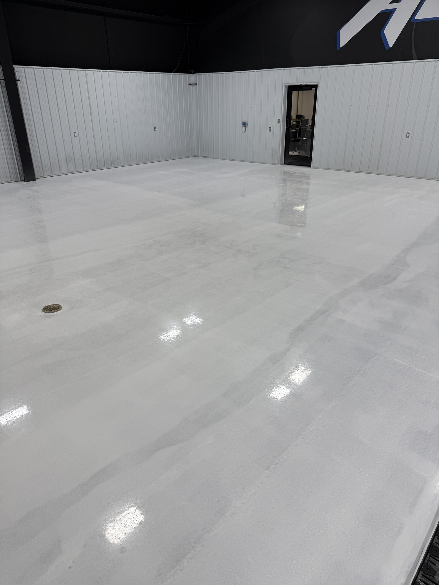AutoHouse of Bloomington Metallic Epoxy Showroom Floor - Photo 7