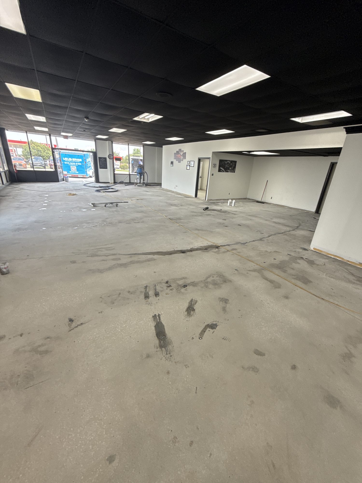 Twin City Automall Metallic Epoxy Showroom Floor - Before