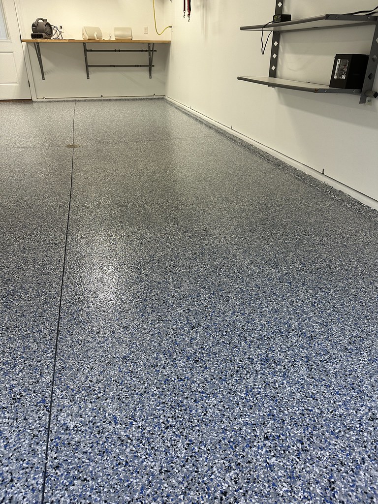 A close up of garage floor after polyaspartic top coat