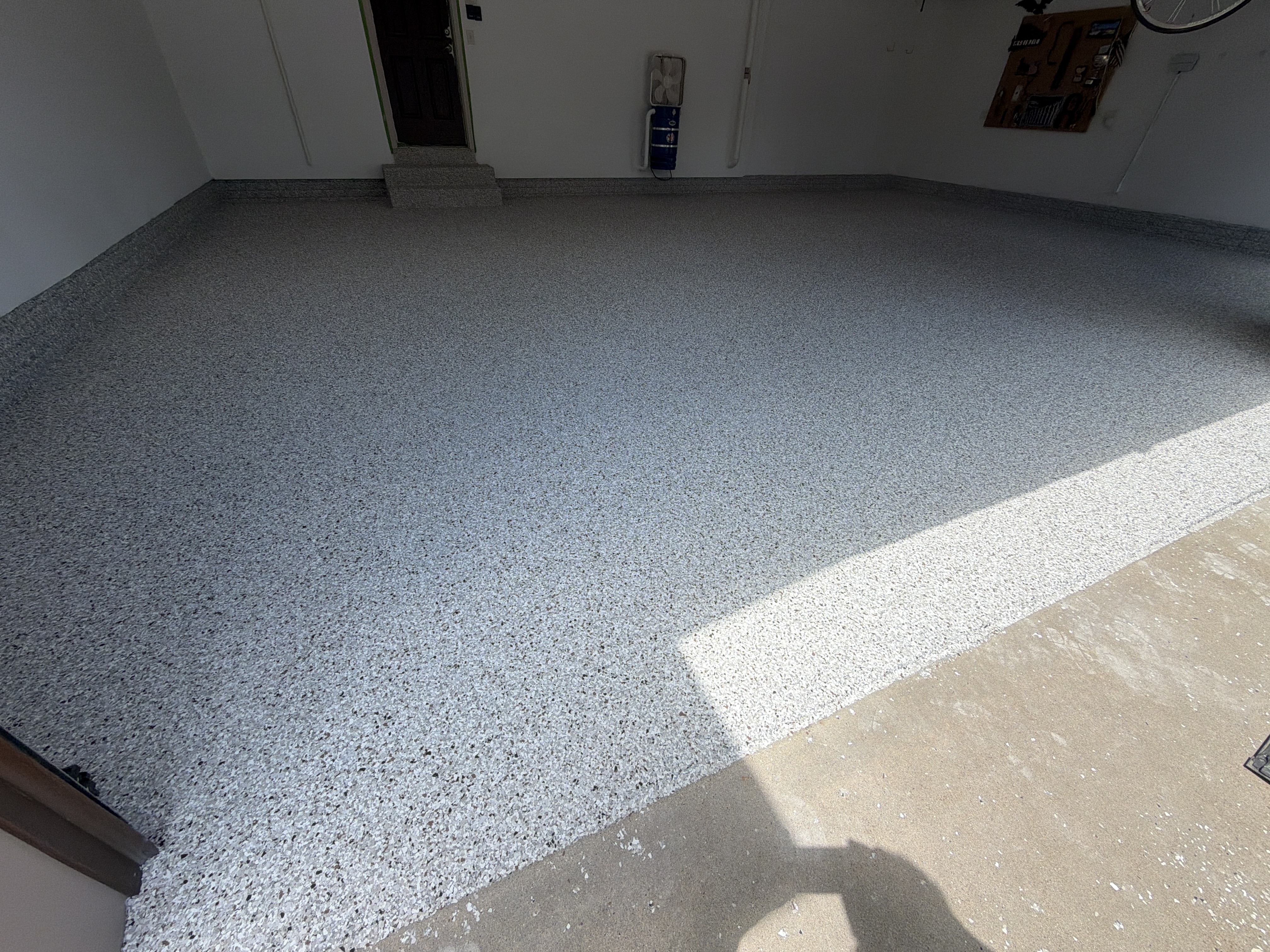 Broadcasting Coyote flakes onto the wet base coat