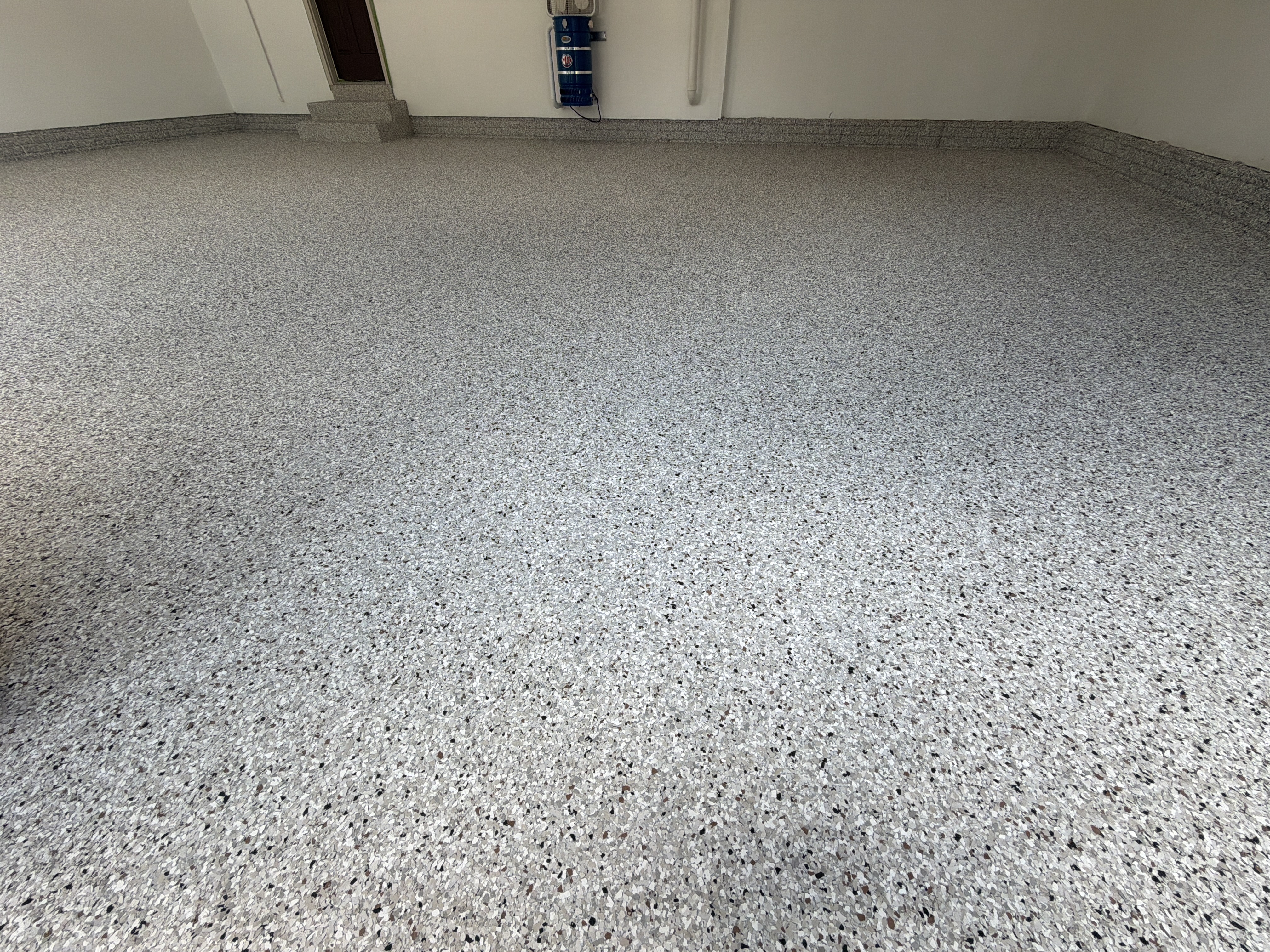Applying the base coat to Kirk's Bloomington garage floor