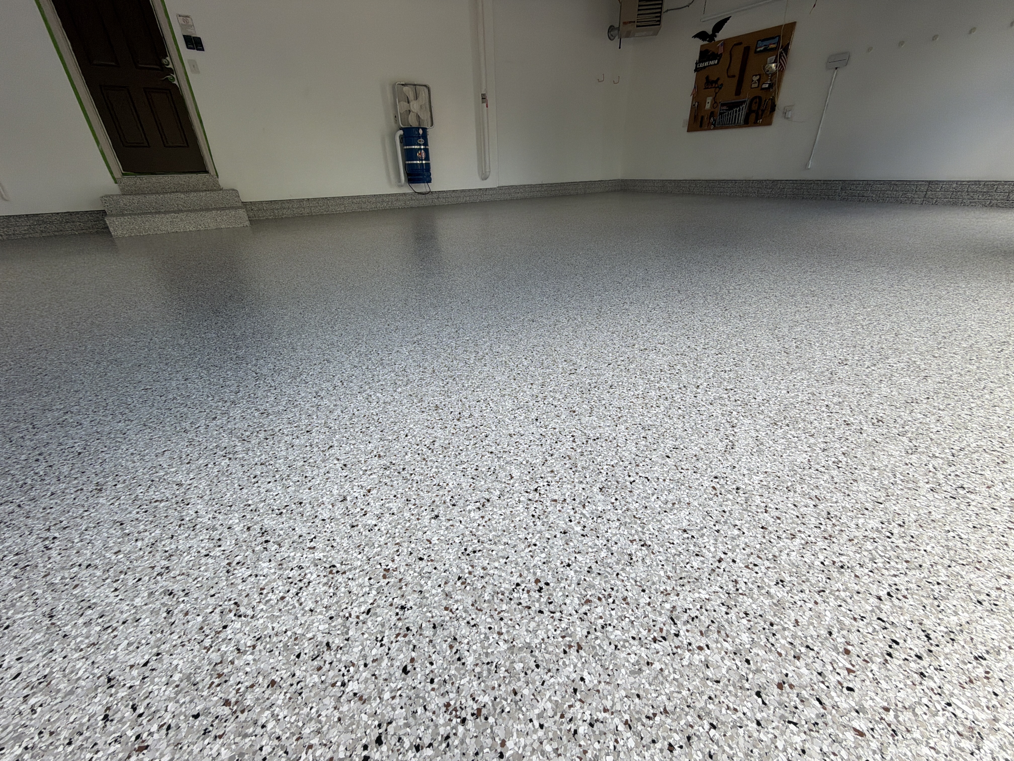 Finished Coyote Polyaspartic garage floor and wall coating