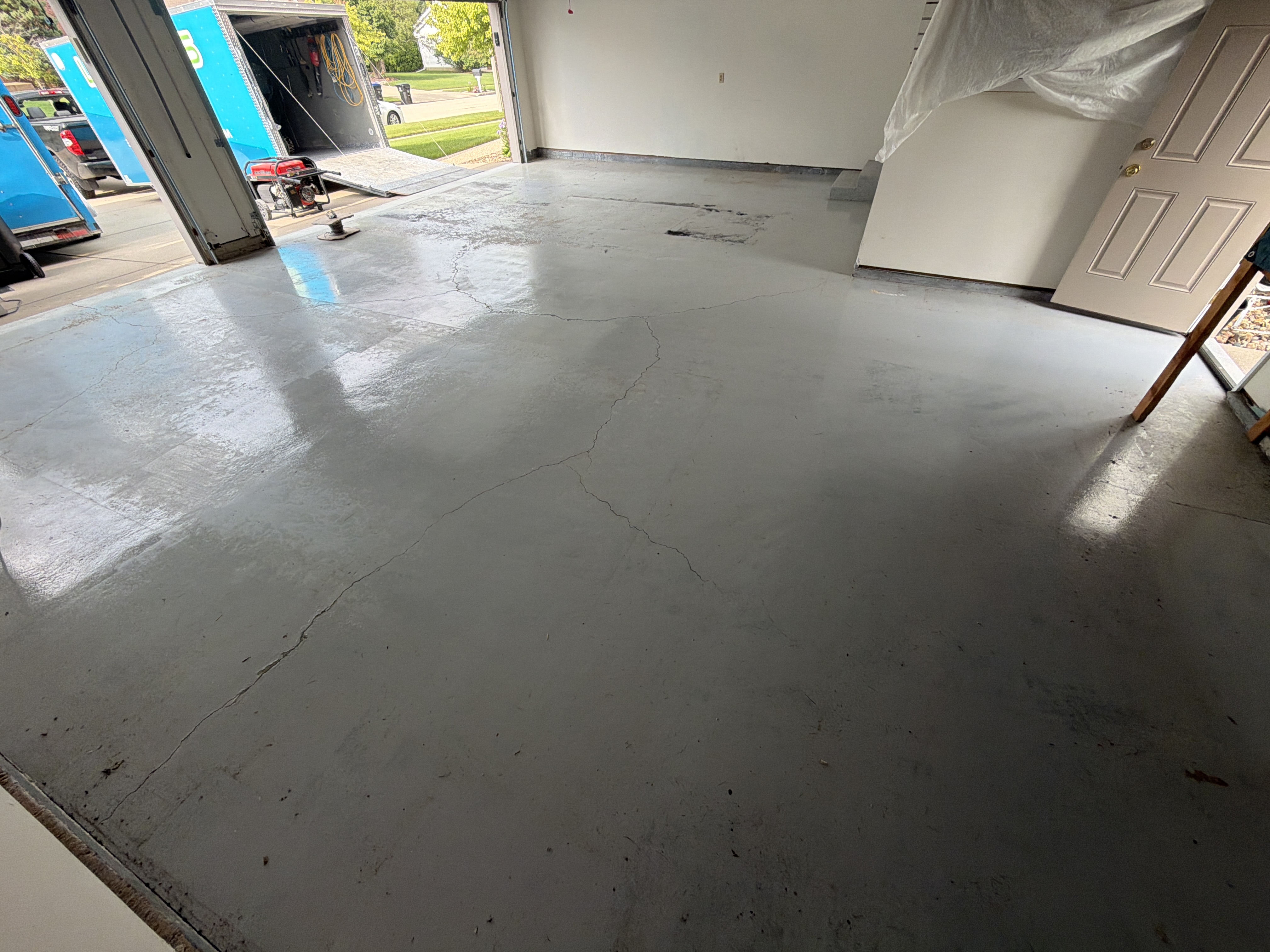 Another view of the original concrete garage floor condition