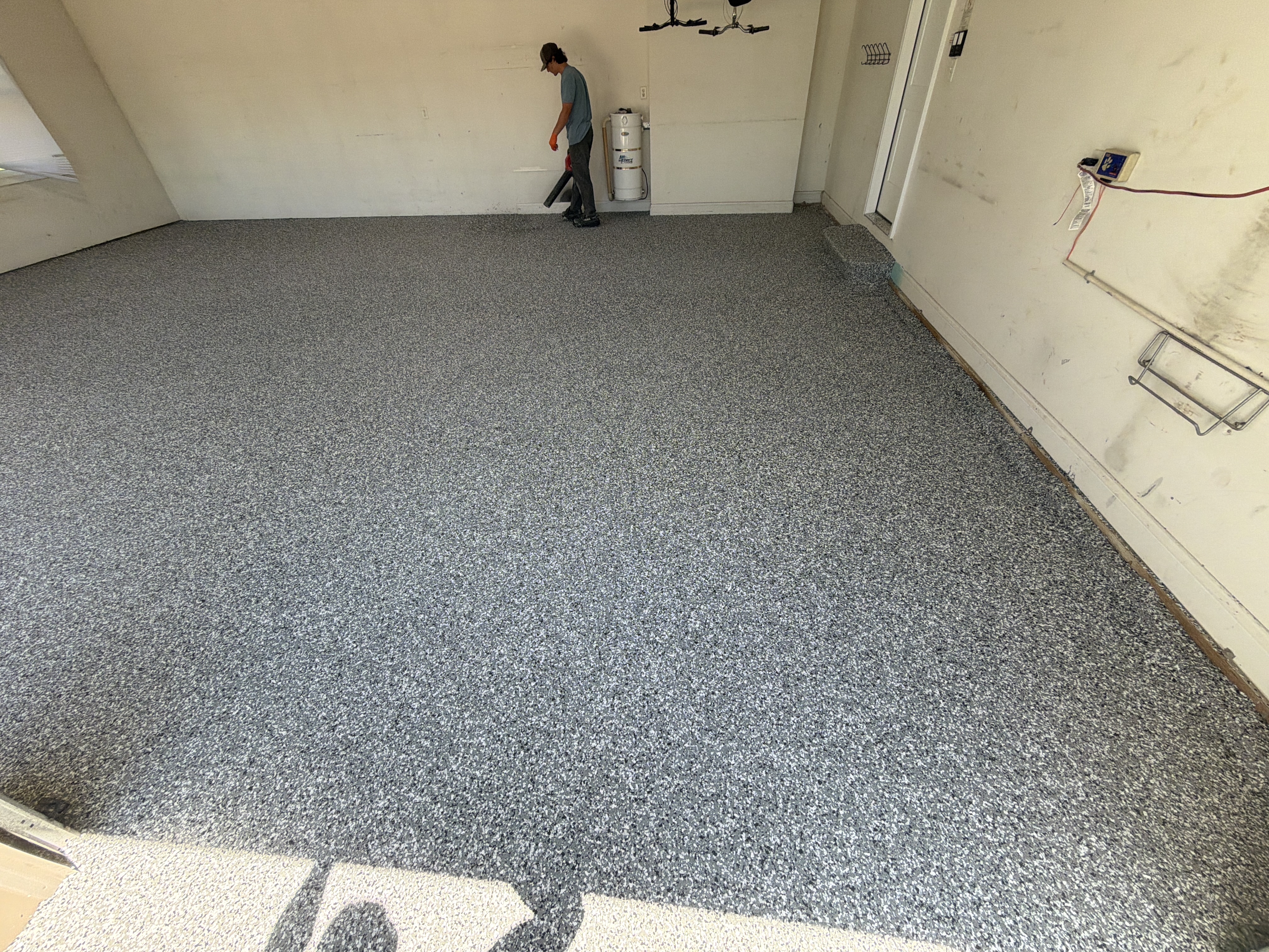 Broadcasting the Wombat flakes onto the wet base coat for a seamless, durable finish.