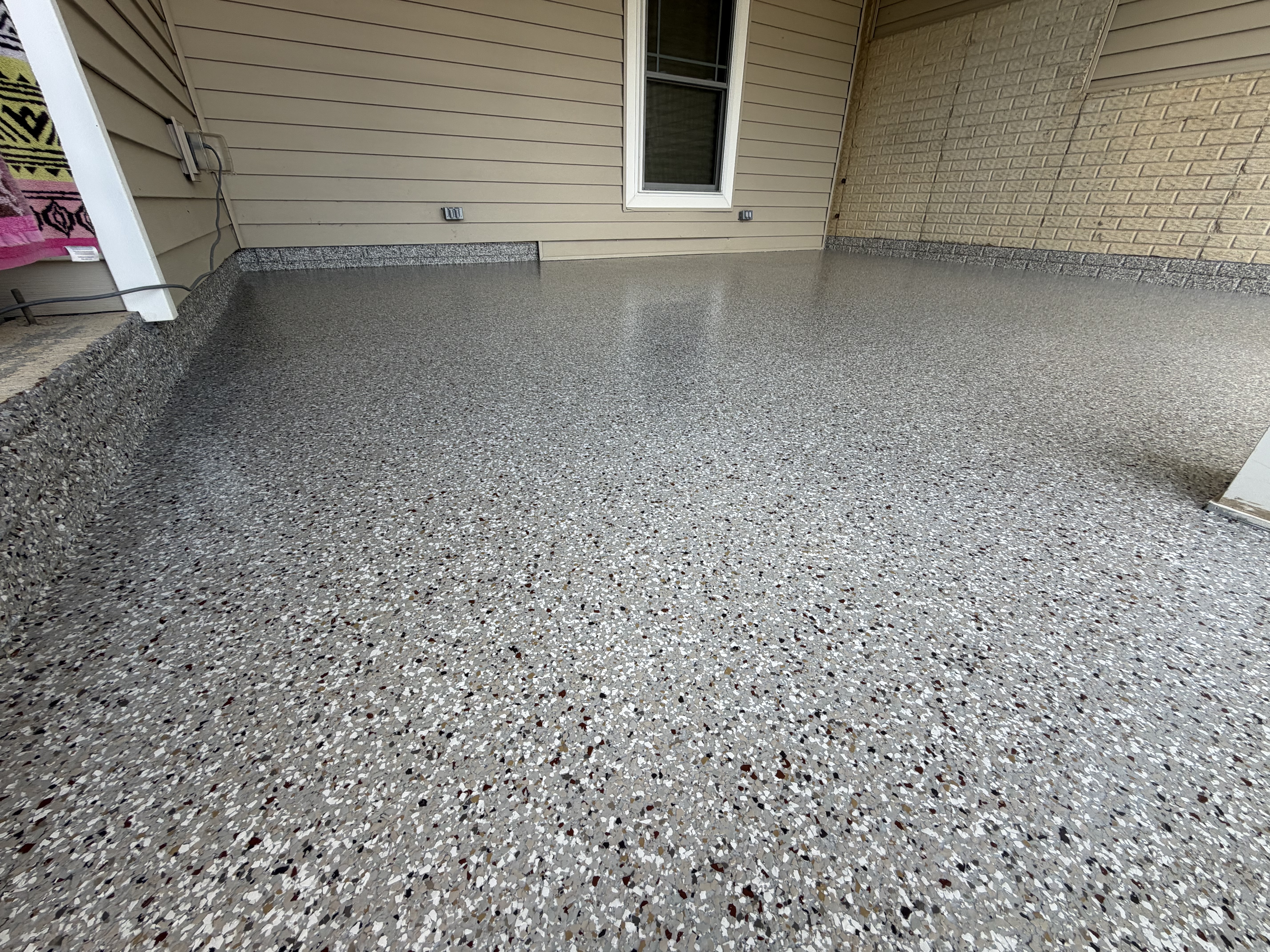 The beautiful Creekbed polyaspartic patio coating in Armington