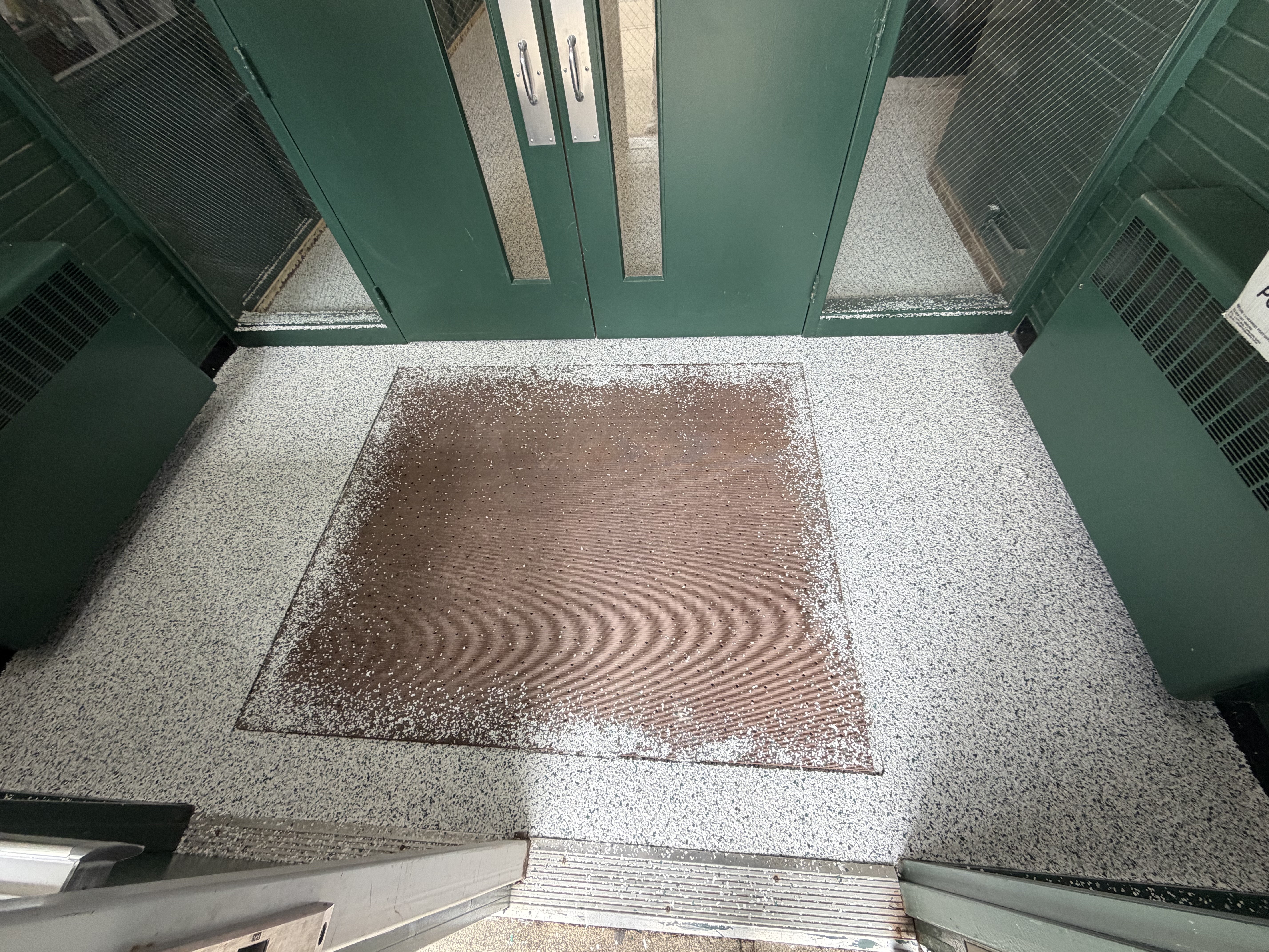 Outside the church door after applying basecoat and broadcasting flake