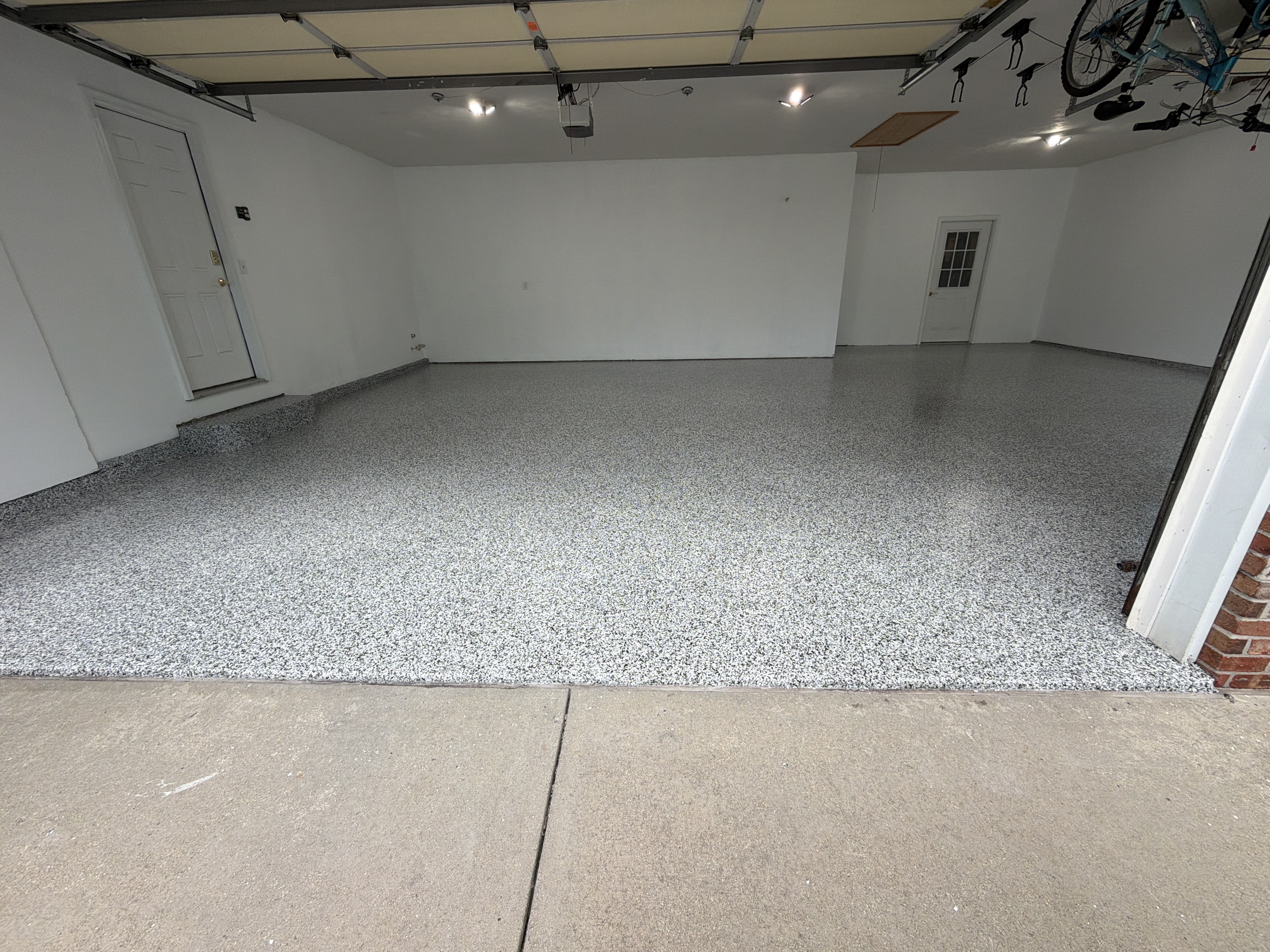 Normal Garage Floor Coating: Andy's Stunning Domino Polyaspartic Transformation