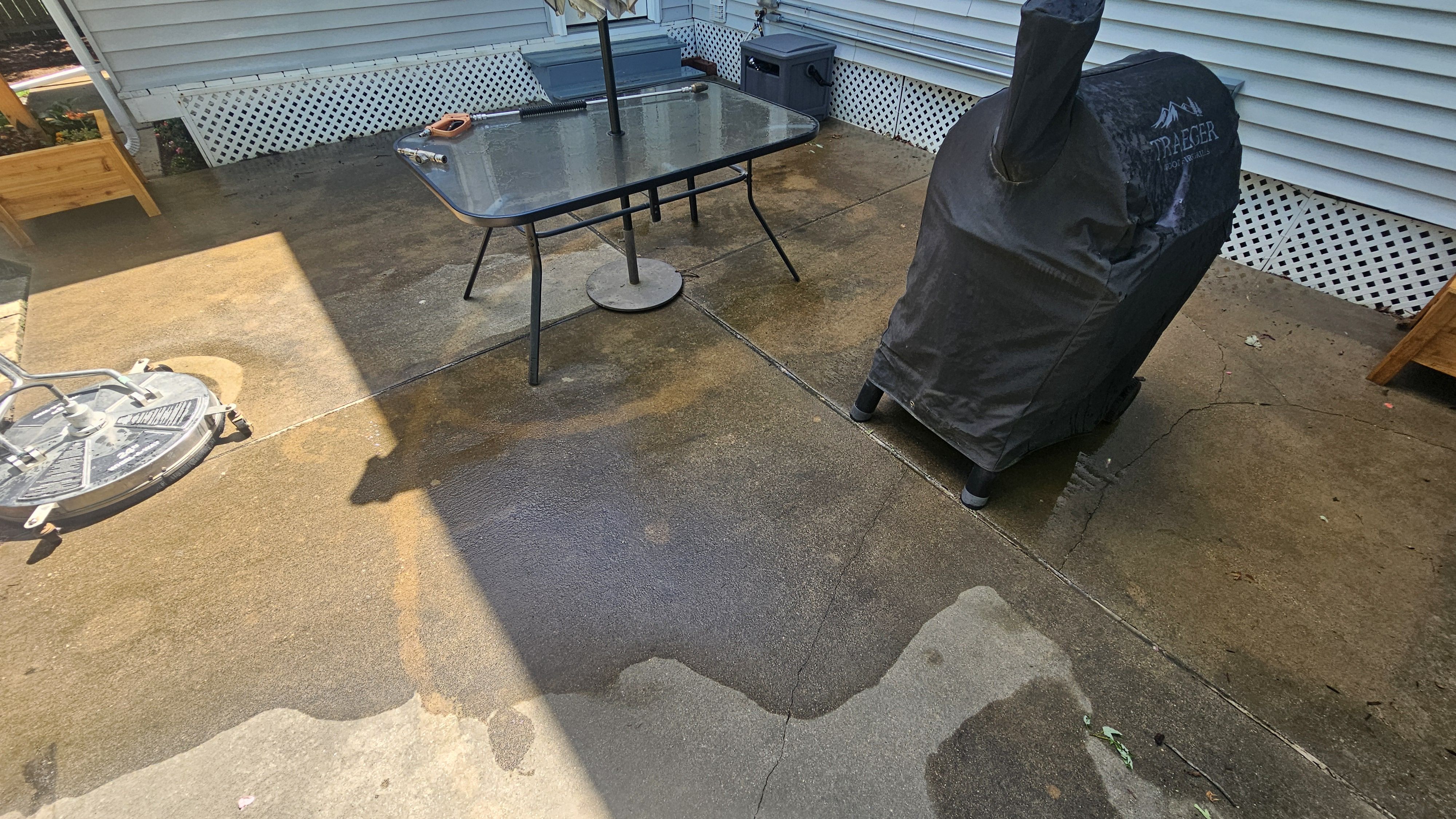 Loud Bros team performing surface preparation for concrete cleaning
