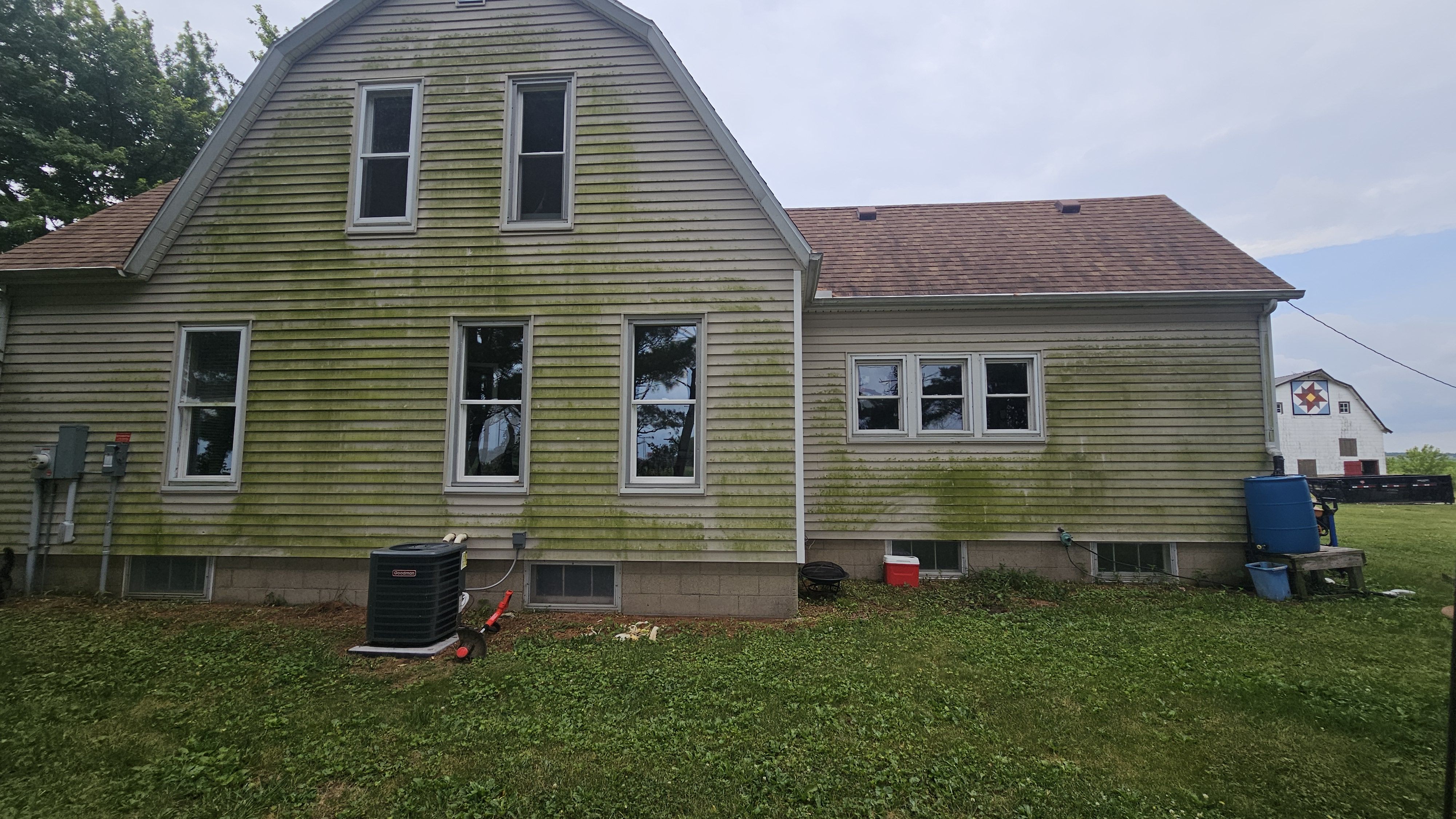 Another view of the Heyworth home's exterior showing its original dirty condition.