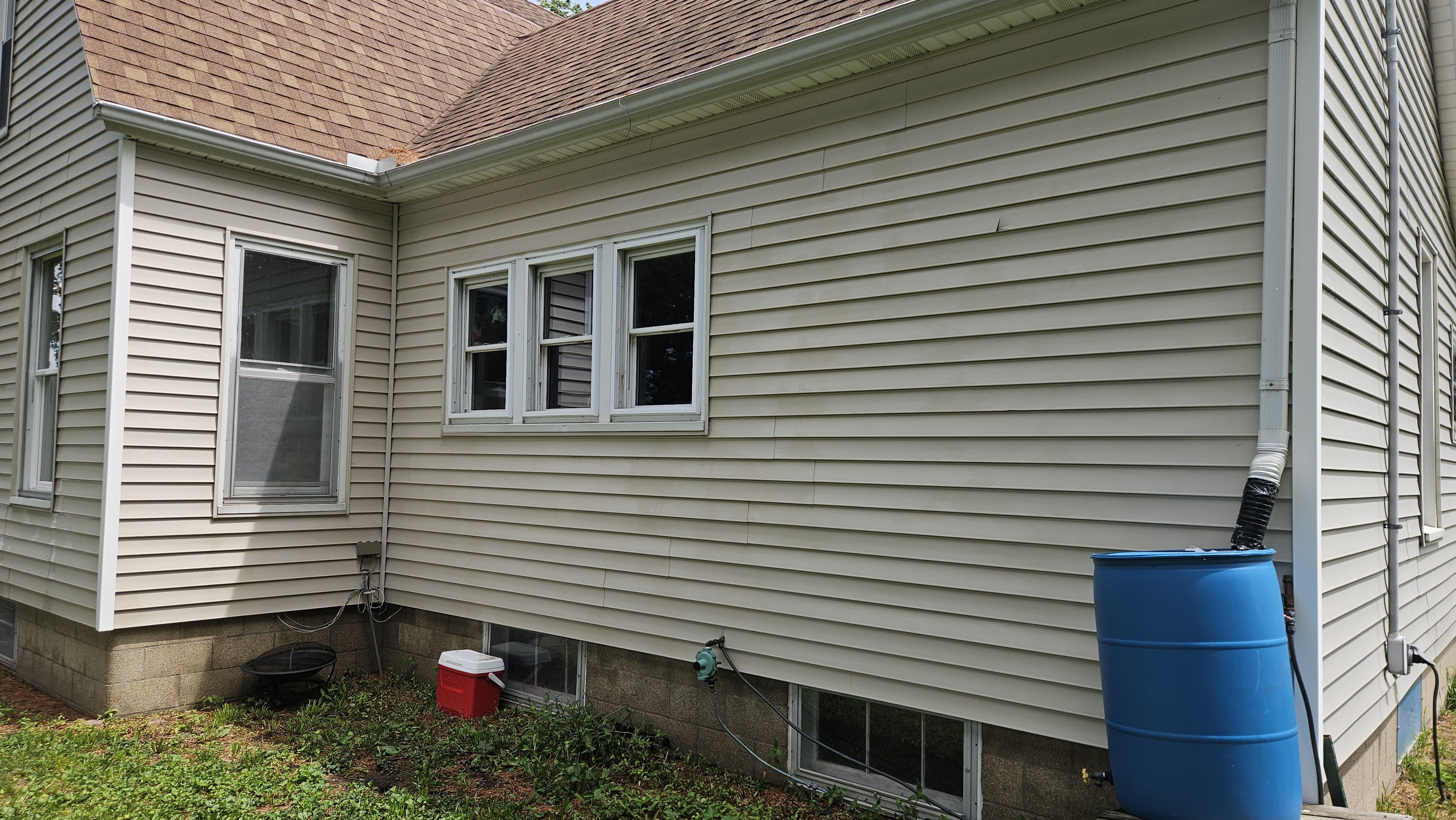 The beautifully cleaned exterior after Loud Bros' house wash and deck restoration.