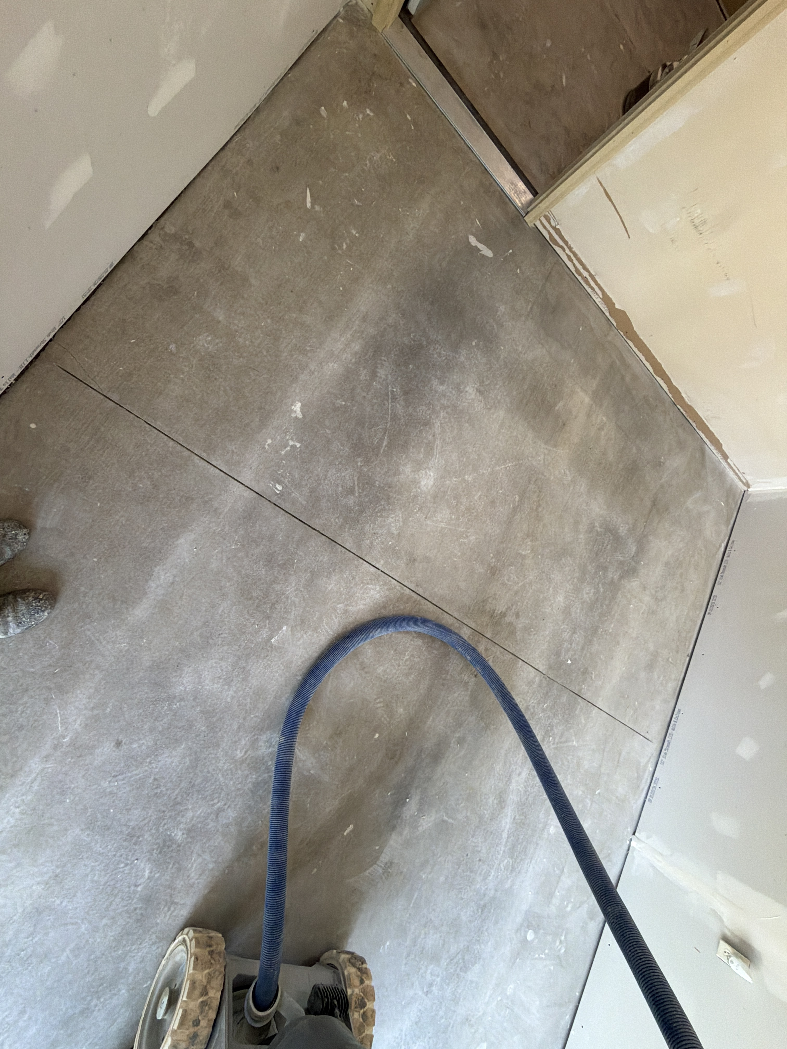 A closer look at the pre-existing condition of Lonnie's Atlanta, IL garage floor, highlighting the lack of protective coating.