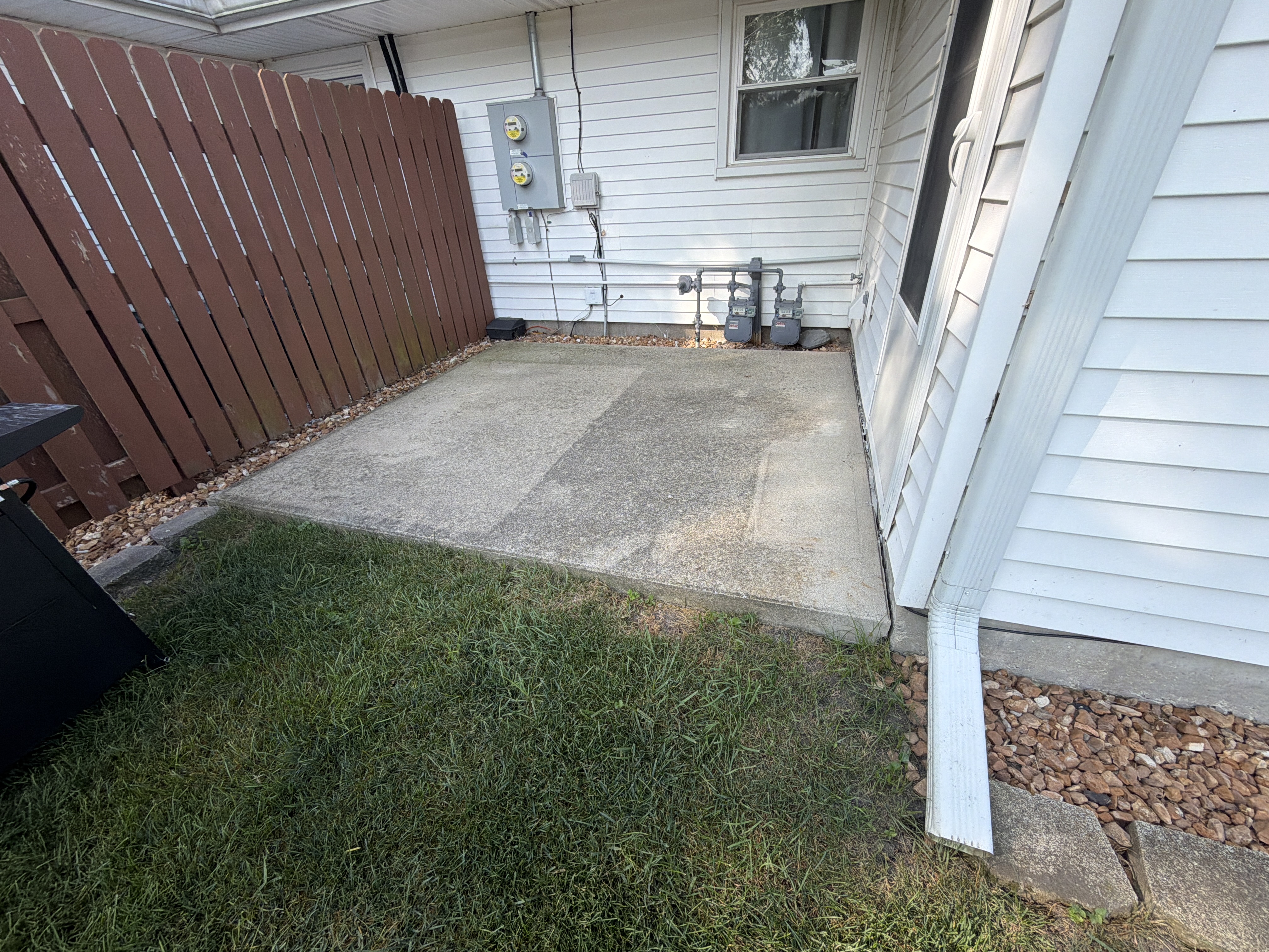 One final pre-job photo capturing the overall dull and unprotected state of the garage floor that was ready for an upgrade.