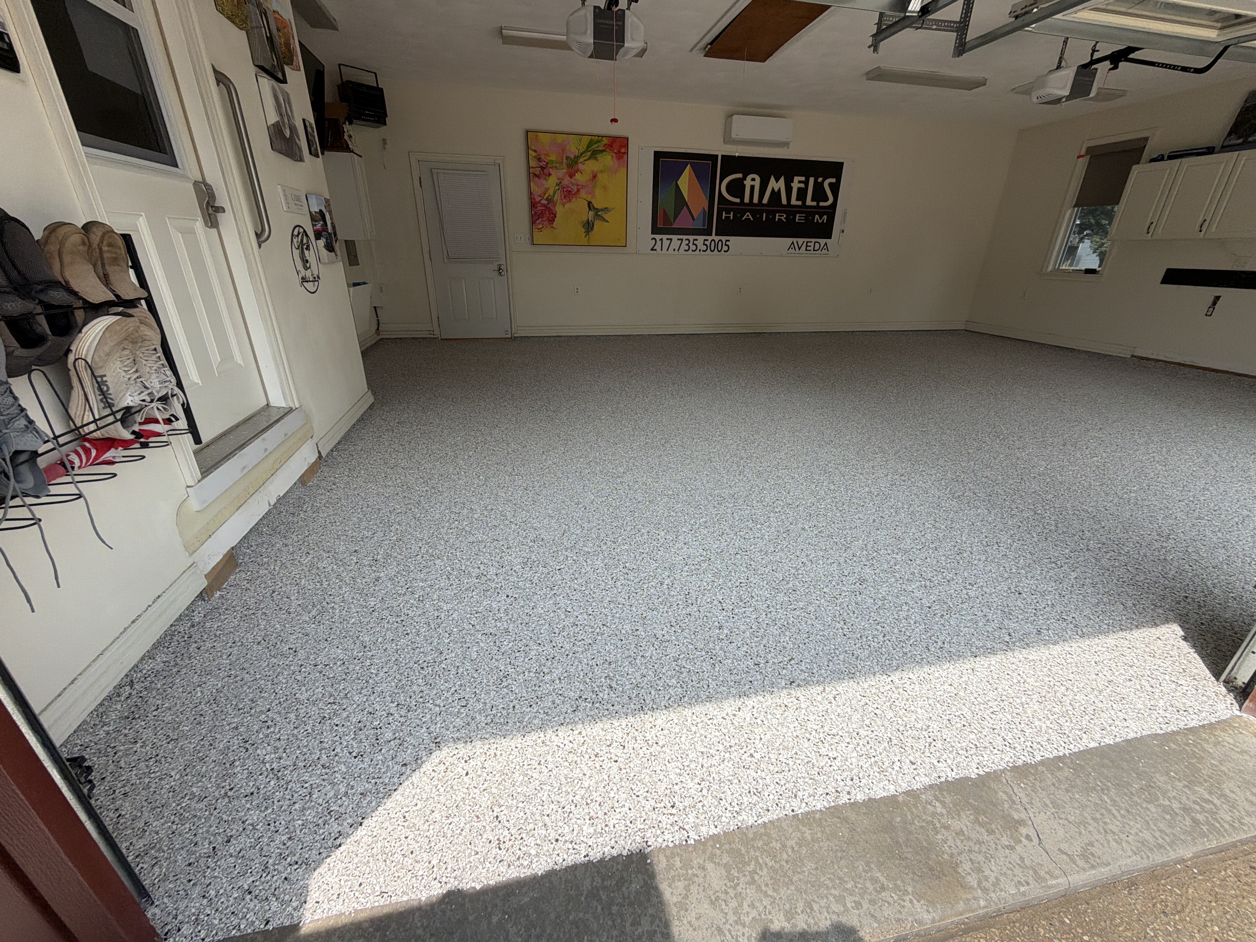 Applying the base coat to John's garage floor before flake broadcast